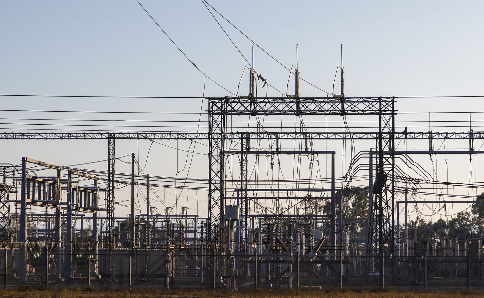High-voltage transmission substation at dawn